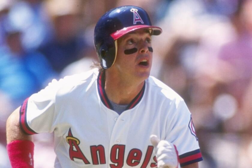 Wally Joyner hits a home run for the Angels in 1991.