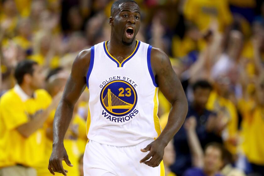 Draymond Green reacts after making a three-point shot on June 19.