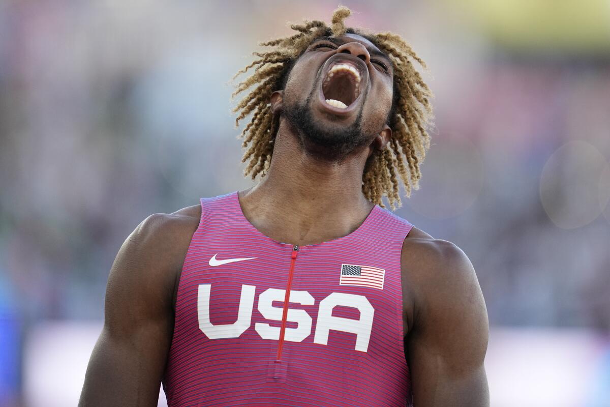 Noah Lyles lets out a scream after winning the men's 200-meter final at the World Athletics Championships last year.
