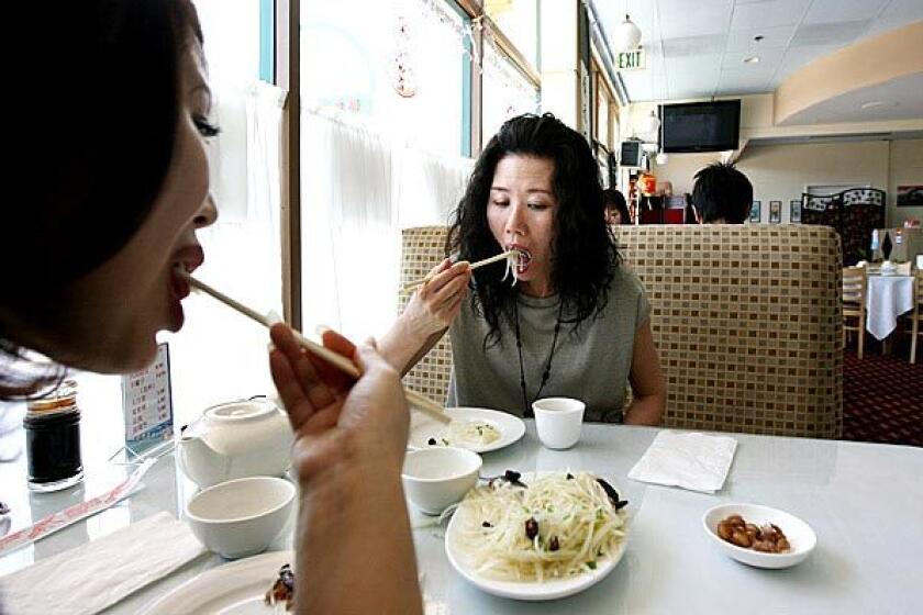 Linda Zhao of Torrance, left, and Daisy Deng of San Dimas enjoy lunch at Beijing Restaurant in San Gabriel.