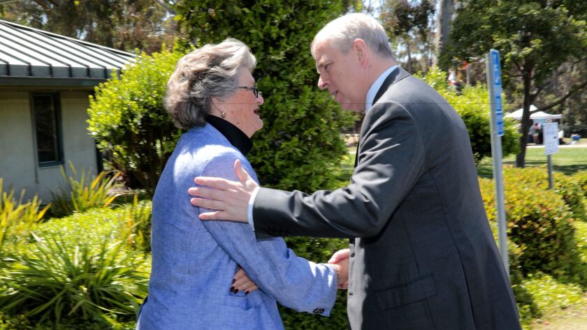 Prince Andrew, the Duke of York, warmly greets Mary Walshok, a UC San Diego dean, during his campus visit on May 3, 1917. Times have changed since 1983 when then San Diego Mayor Bill Cleator was accused of scandalizing Brits by touching Queen Elizabeth II during her visit here.
