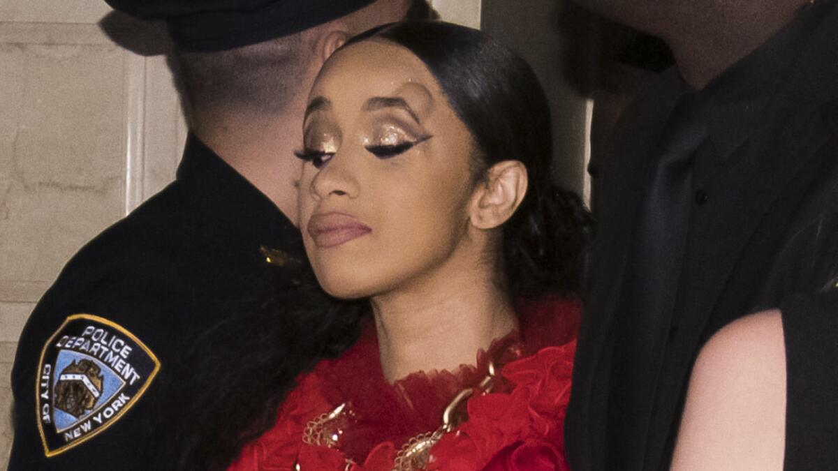 Cardi B, with a bump on her head, leaves after an altercation at the Harper's Bazaar party at the Plaza in New York.