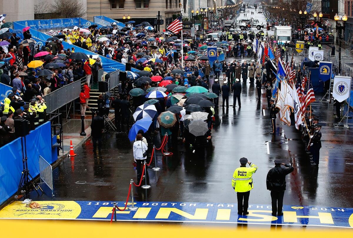 Former Boston Mayor Thomas Menino, current Mayor Martin Walsh, Vice President Joe Biden and Gov. Deval Patrick were among those who gathered to commemorate the first anniversary of the Boston Marathon bombings near the finish line on Boylston Street.