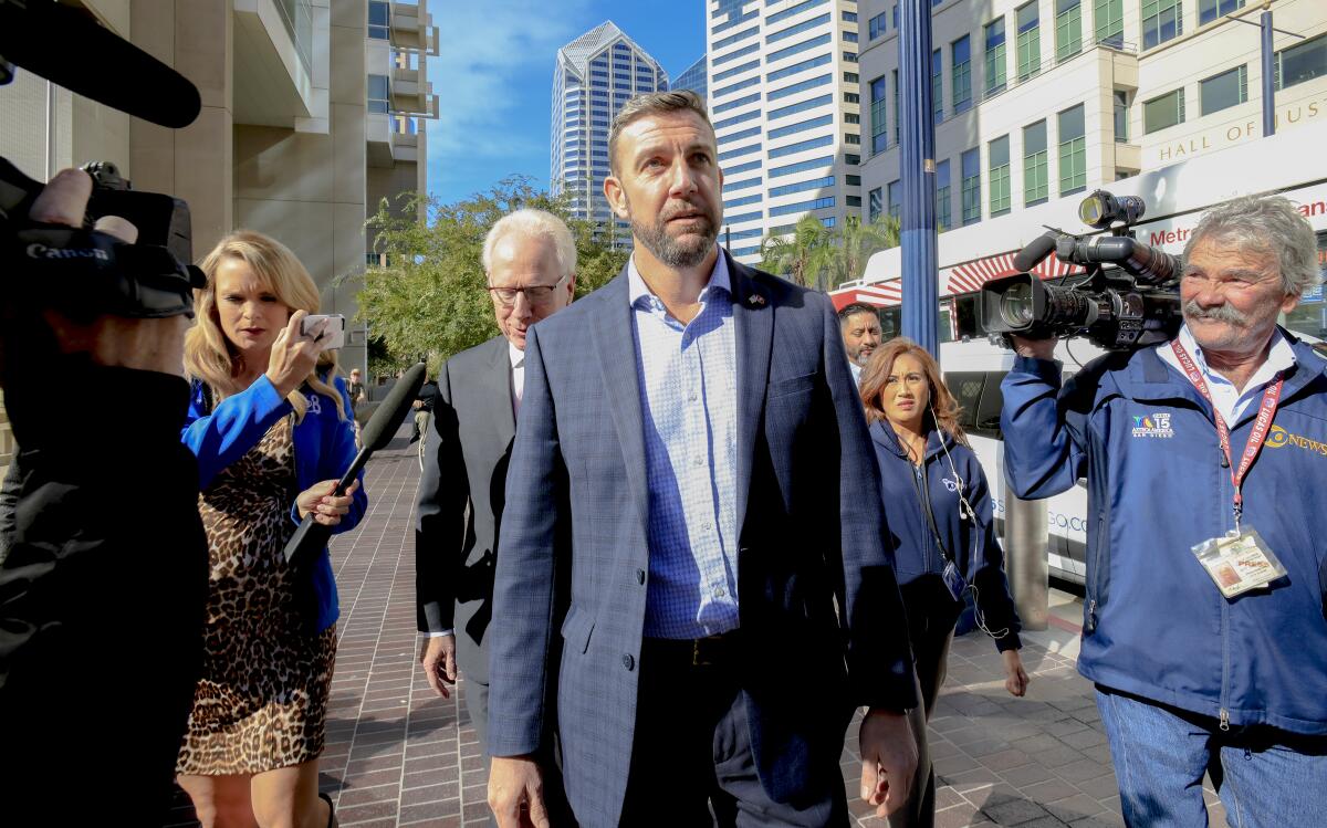 Rep. Duncan Hunter (R-Alpine) arrives at a federal courthouse with his attorney Paul Pfingst on Nov. 25. 