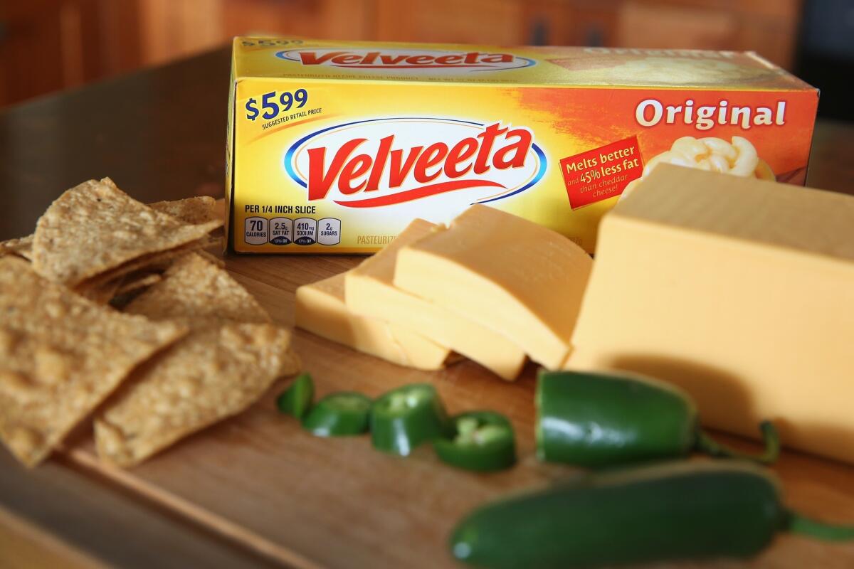 Kraft Foods, the maker of Velveeta Cheese, is in deal to merge with Heinz.