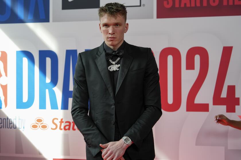 Dalton Knecht poses for photos on the red carpet before the NBA basketball draft, Wednesday, June 26, 2024, in New York. (AP Photo/Julia Nikhinson)