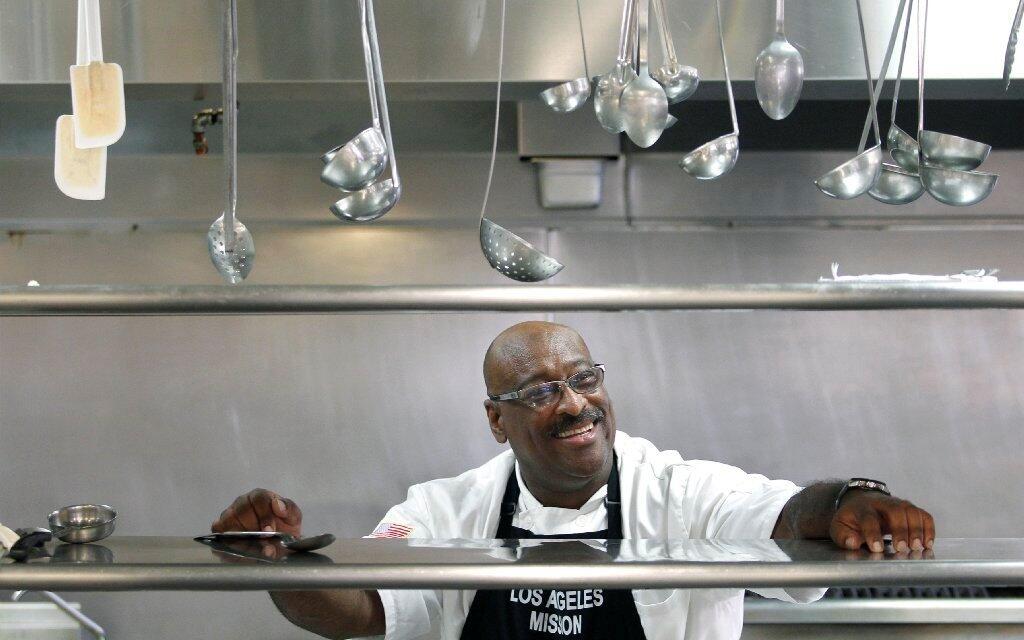 Chris Cormier, director of food services at the Los Angeles Mission in downtown L.A., supervises a kitchen that serves 1,200 to 1,800 meals daily
