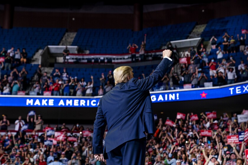 President Donald Trump arrives on stage to speak at a campaign rally at the BOK Center, Saturday, June 20, 2020, in Tulsa, Okla. (AP Photo/Evan Vucci)