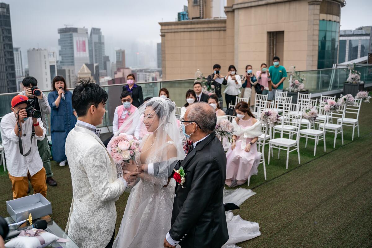 Hong Kong has limited the size of weddings to 20 people as part of social distancing measures.