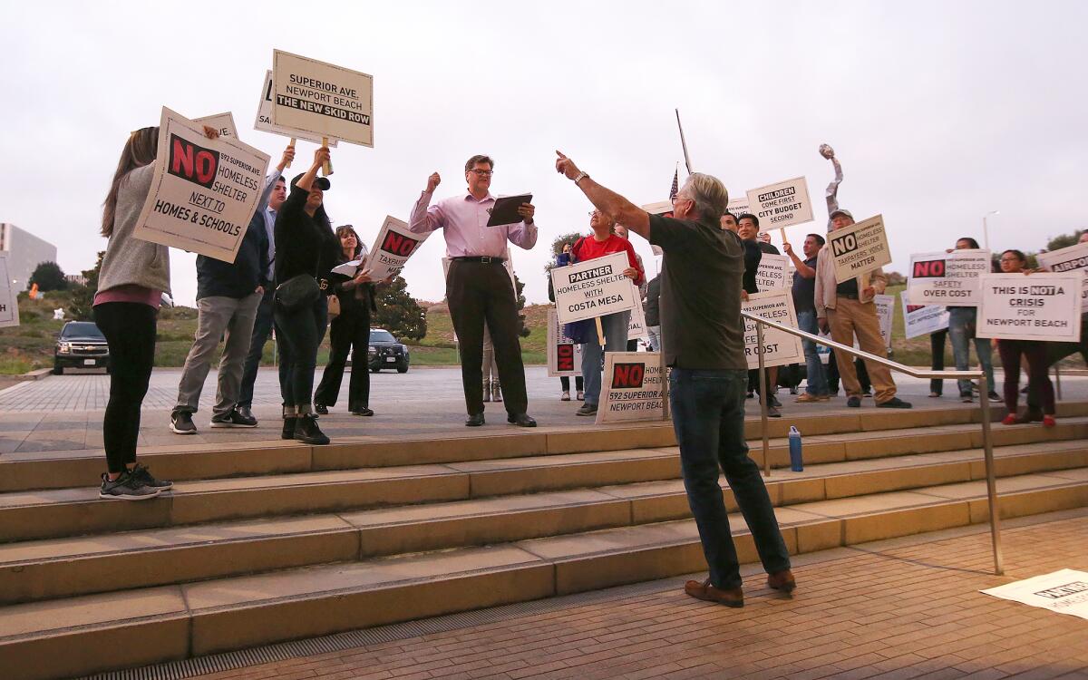 Newport Beach City Hall residents protest a proposed homeless shelter
