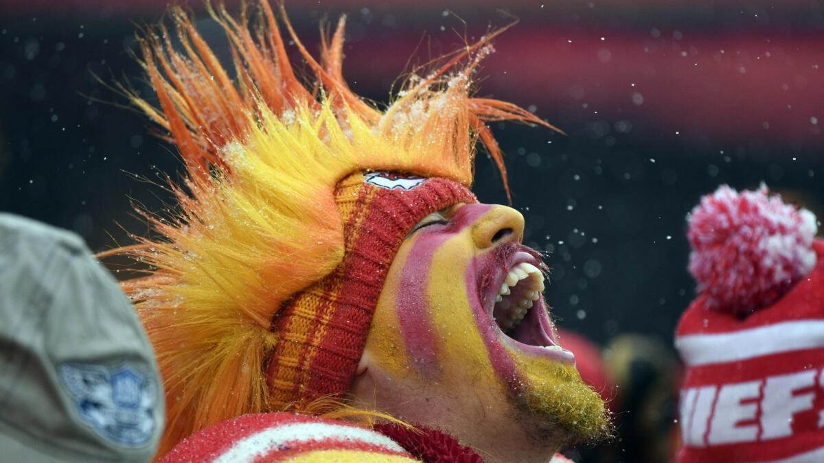 A Kansas City fan yells in the stands during the first half of last week's game. Football is the one sport where the season doesn’t seem long enough.