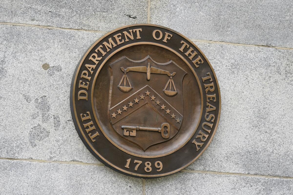 The Department of the Treasury's seal outside the Treasury Department building in Washington on May 4, 2021. The Treasury Department said Monday that it has sanctioned a group of high-ranking members of the Somalia-based al-Shabab militant group, who act as key middle men between the group and local companies in Somalia. Treasury's Office of Foreign Assets Control imposed the sanctions on more than a dozen individuals from Somalia and Yemen who are involved in al-Shabab's financing operations which in turn use those funds to assist in weapons procurement and recruitment activities. (AP Photo/Patrick Semansky, File)
