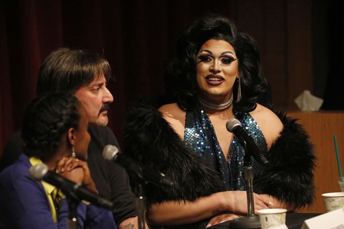 Jason De Puy, dressed in drag, talks about his sobriety and former use of drugs during sex as a member of a panel at a town hall for a discussion about sex and the use of substances such as meth, GHB, cocaine and MDMA at the West Hollywood City Council chambers on Wednesday.