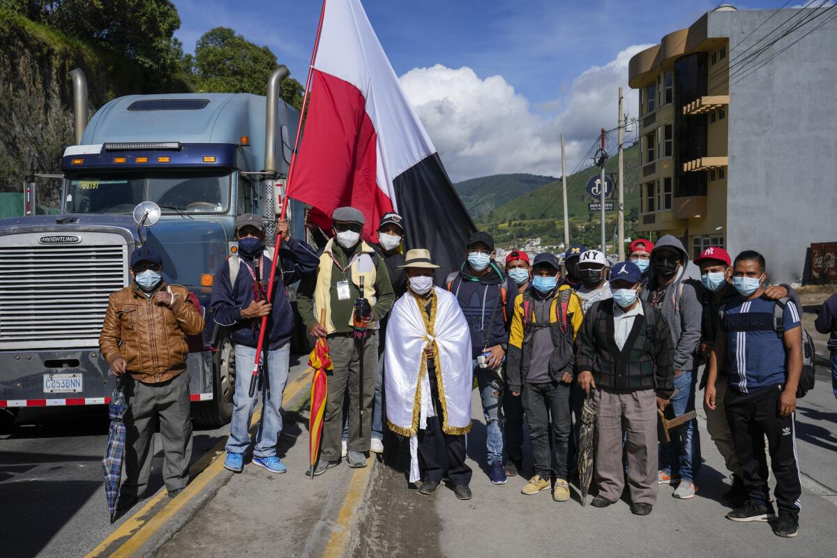 Mayor Jose Tax Sapon wears a white flag during a protest on a highway