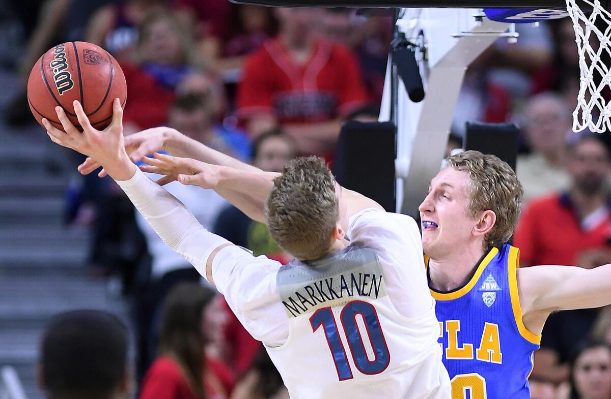 Bruins center Thomas Welsh, trying to block a shot by Wildcats forward Lauri Markkanen last season, is adding a long-range shooting option to his game.