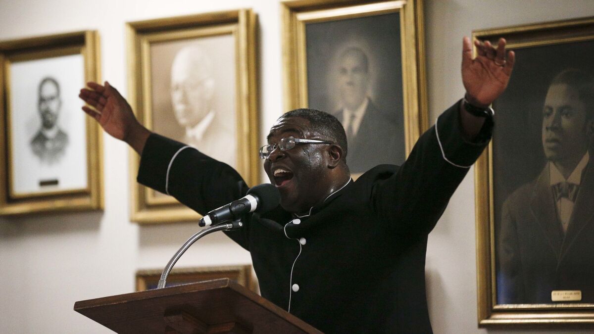 The Rev. Arthur Price Jr. preaches at the 16th Street Baptist Church on Sunday in Birmingham, Ala. "There's too much at stake for us to stay home," Price told the mostly black congregation ahead of Alabama's U.S. Senate election Tuesday.