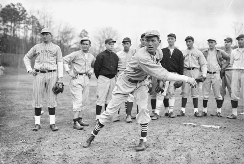 FILE - In this Feb. 18, 1935 file photo, Dizzy Dean gives a group of rookies a pitching lesson at a baseball school in Hot Springs, Ark. Some of baseball’s most famous players spent time in Hot Springs, which was one of the first locations used for spring training, and visitors can check out spots on the Historic Baseball Trail marking important moments in the city’s ties to the sport. (AP Photo, File)