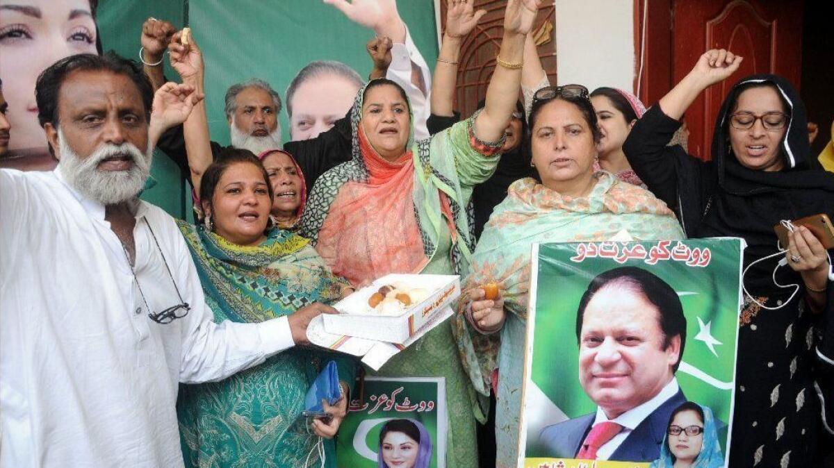 Supporters of former Pakistani Prime Minister Nawaz Sharif celebrate in the city of Multan after a court ordered his release on bail as he appeals his corruption conviction.