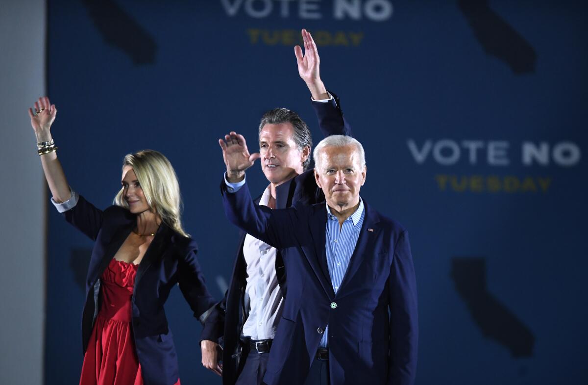 President Biden, Gov. Gavin Newsom and his wife, Jennifer Siebel Newsom, at campaign rally