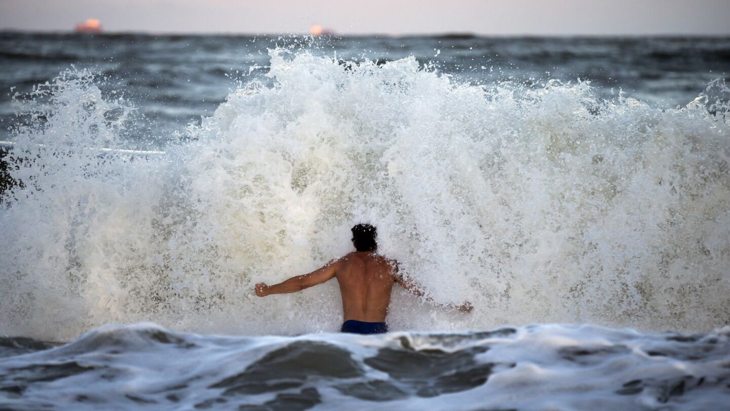 Body surfer Andrew Vanotteren, of Savannah, Ga., crashes into waves from Hurricane Florence, Wednesday, Sept., 12, 2018, on the south beach of Tybee Island, Ga. Vanotteren and his friend Bailey Gaddis said the waves have gotten bigger and better every evening as the storm approaches.