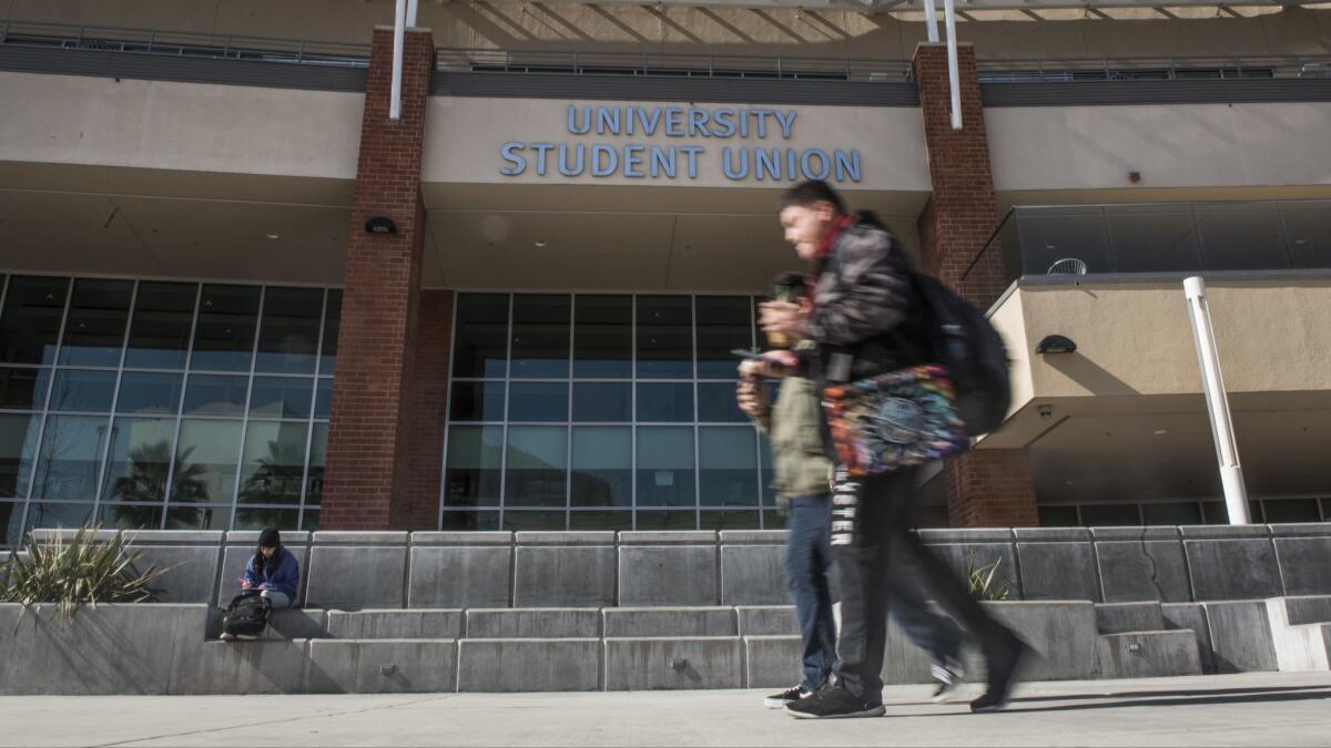 Students walk on the campus of Cal State Los Angeles.