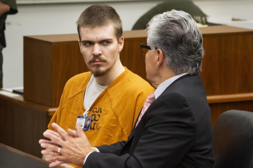 Samuel Woodward talks to his attorney Edward Munoz during a court hearing at the Harbor Justice Center in Newport Beach, Calif., on Wednesday, Aug. 22, 2018. Woodward is charged with the murder of a University of Pennsylvania student Blaze Bernstein. (Paul Bersebach/The Orange County Register via AP, Pool)