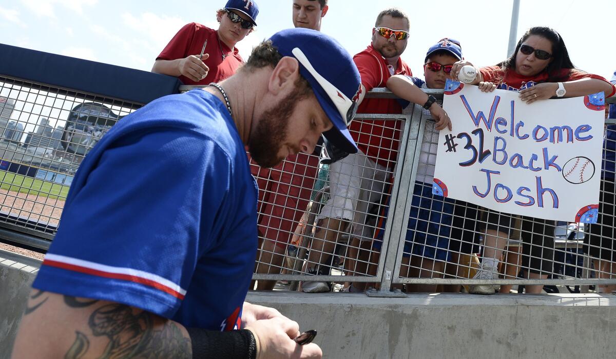 Rangers outfielder Josh Hamilton signs autographs for fans while playing for triple-A affiliate Round Rock on Sunday.