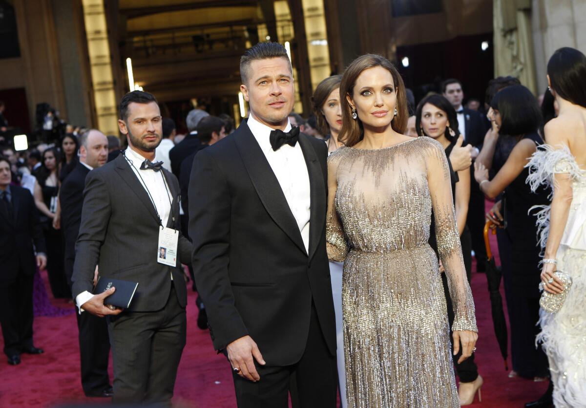Angelina Jolie, with Brad Pitt at the 86th Academy Awards on Sunday, says she can slip into a softer side at home.