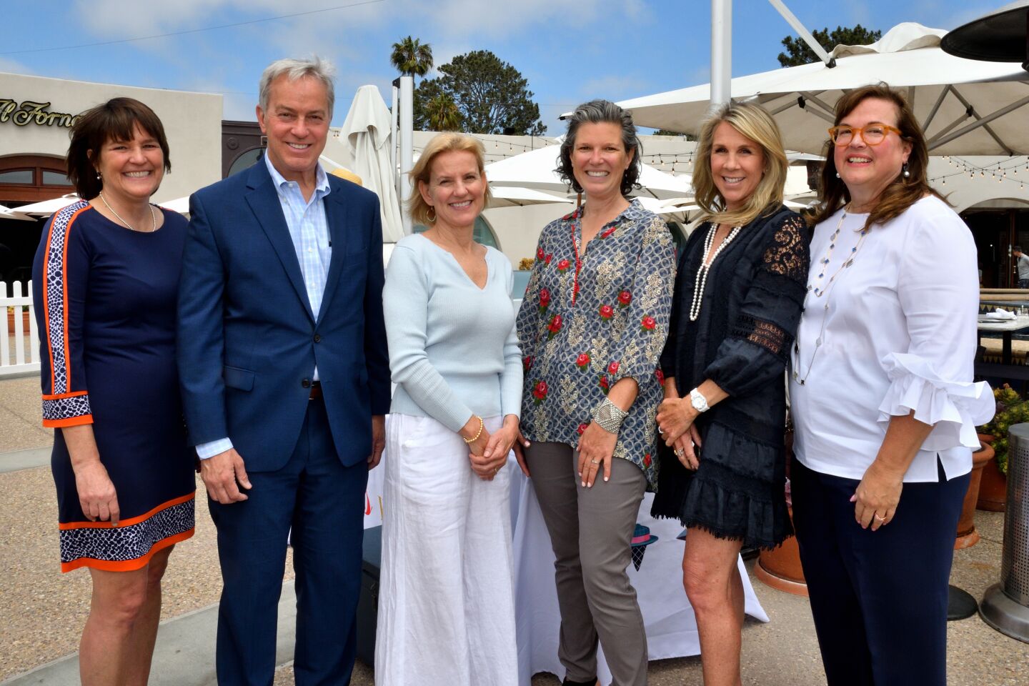 Voices for Children President and Chief Executive Kelly Douglas, NBC7 anchor Mark Mullen, Court Appointed Special Advocate Alice Brewer, author Meredith May and event co-chairwomen Patty Brutten and Marina Marrelli attend Voices for Children's "Uplifting Voices" fundraiser May 7.