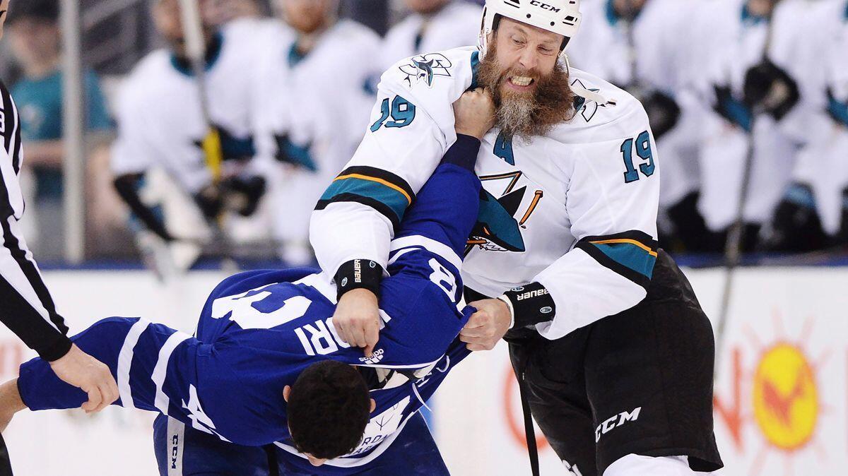 The San Jose Sharks' Joe Thornton, right, fights with the Toronto Maple Leafs' Nazem Kadri during a Jan. 4 game in Toronto.