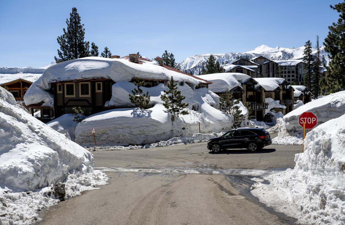 Rooftops and sidewalks are still covered in volumes of snow in Mammoth Lakes, California.  