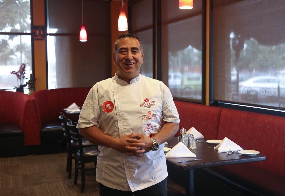 Leo Razo stands in the dining room of Villa Roma restaurant and market in Laguna Hills.