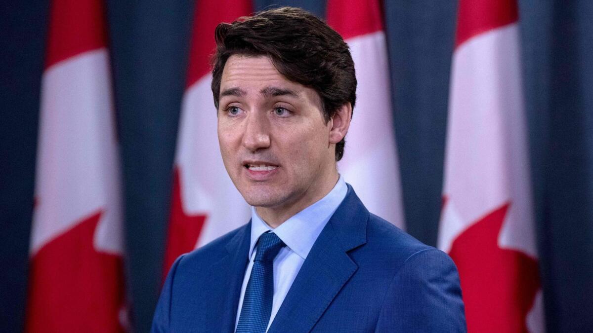 Canadian Prime Minister Justin Trudeau speaks to the media in Ottawa, Ontario, on Thursday. A former justice minister has accused him of applying inappropriate pressure in a corruption prosecution.