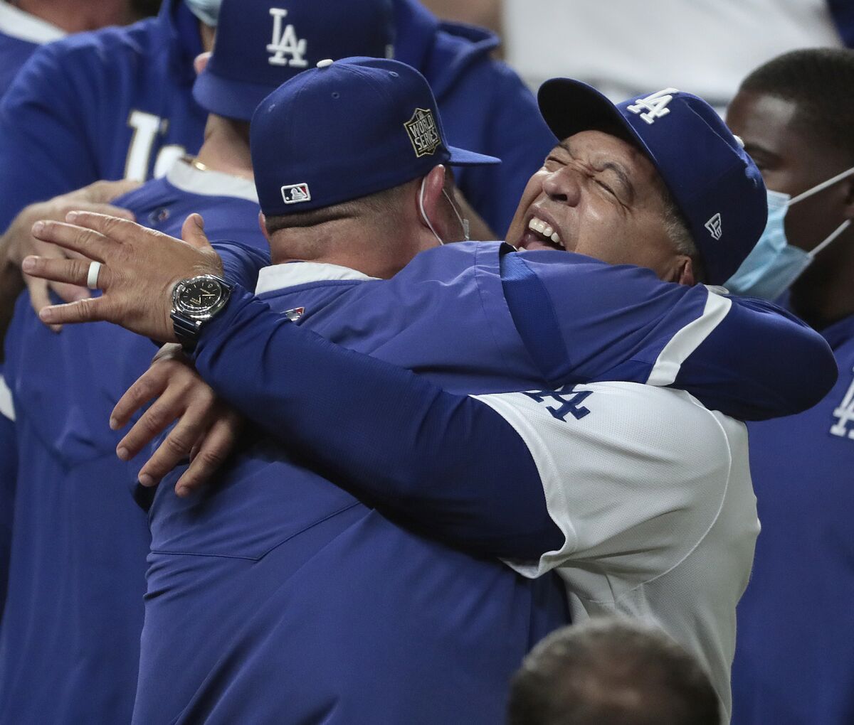 Dodgers manager Dave Roberts celebrates with the team after clinching the 2020 World Series at Globe Life Field. 
