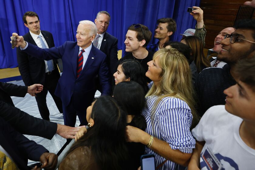 OCEANSIDE, CA - NOVEMBER 3: U.S. President Joe Biden takes a selfie with guests at a rally for Rep. Mike Levin at MiraCosta College on Thursday, November 3, 2022. (K.C. Alfred / The San Diego Union-Tribune)