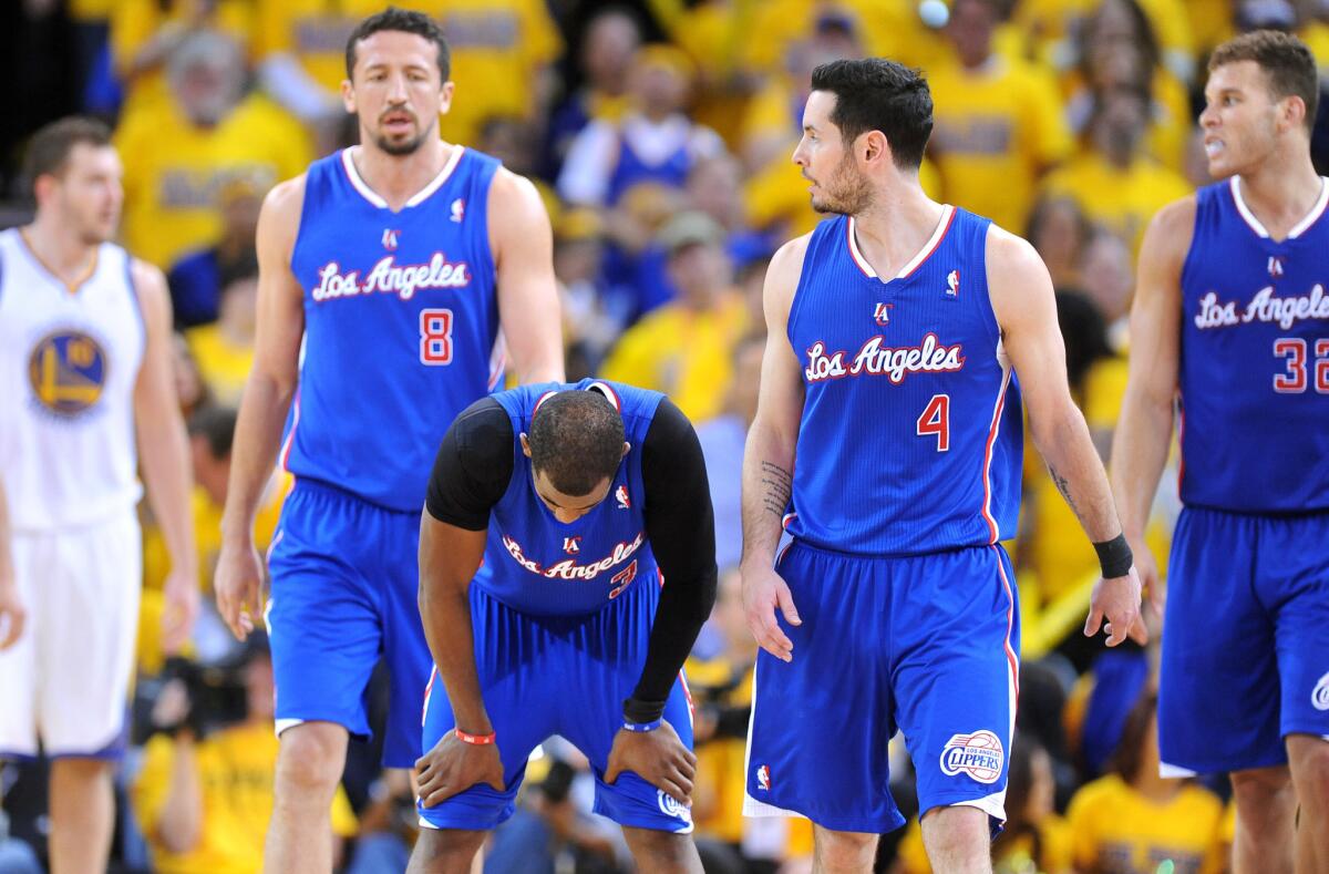 Clippers point guard Chris Paul, second left, catches his breath alongside teammates (from left to right) Hedo Turkoglu, J.J. Redick and Blake Griffin following a turnover during the Clippers' 118-97 loss to the Golden State Warriors in Game 4 of the Western Conference quarterfinals.