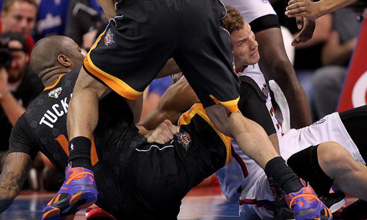 Clippers power forward Blake Griffin, right, gets tangled up with Phoenix Suns forward P.J. Tucker during the Clippers' win Monday at Staples Center. Tucker was ejected after throwing a punch at Griffin.