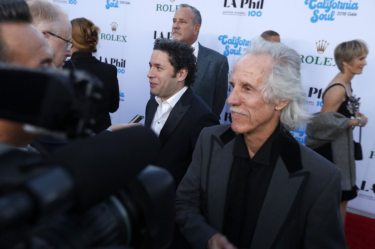 L.A. Philharmonic conductor Gustavo Dudamel and Doors drummer John Densmore speak with reporters.