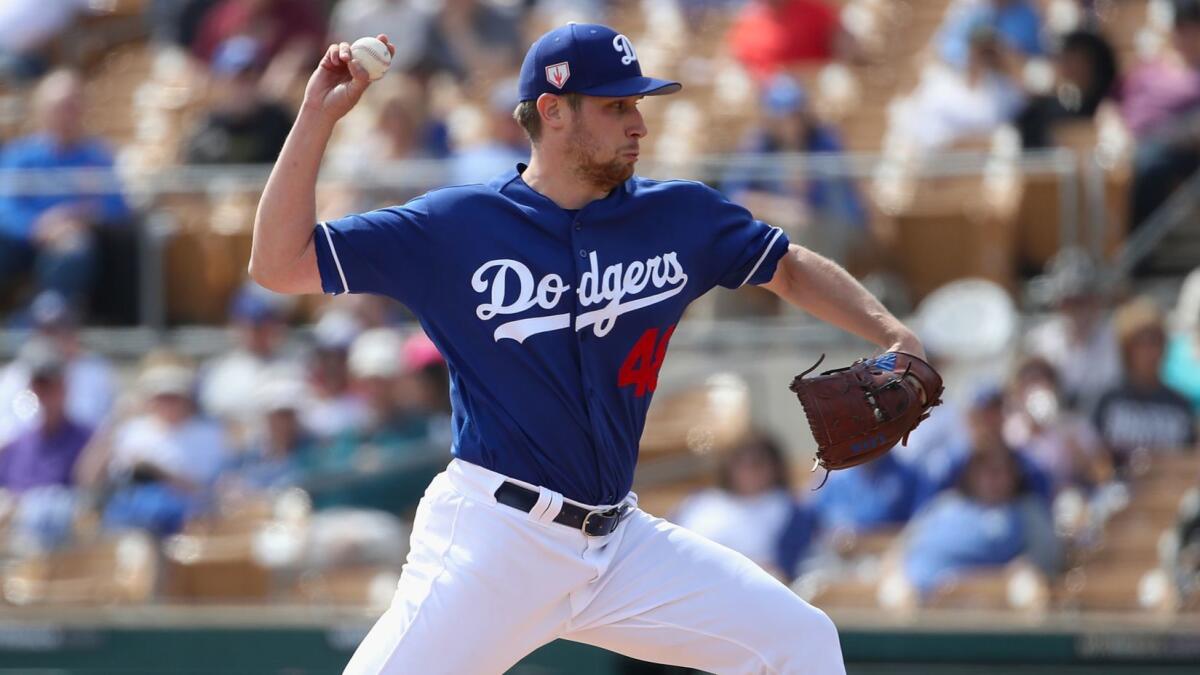 Dodgers pitcher Brock Stewart pitches against the Chicago Cubs during the first inning of a spring training game at Camelback Ranch on Feb. 25 in Glendale, Ariz.