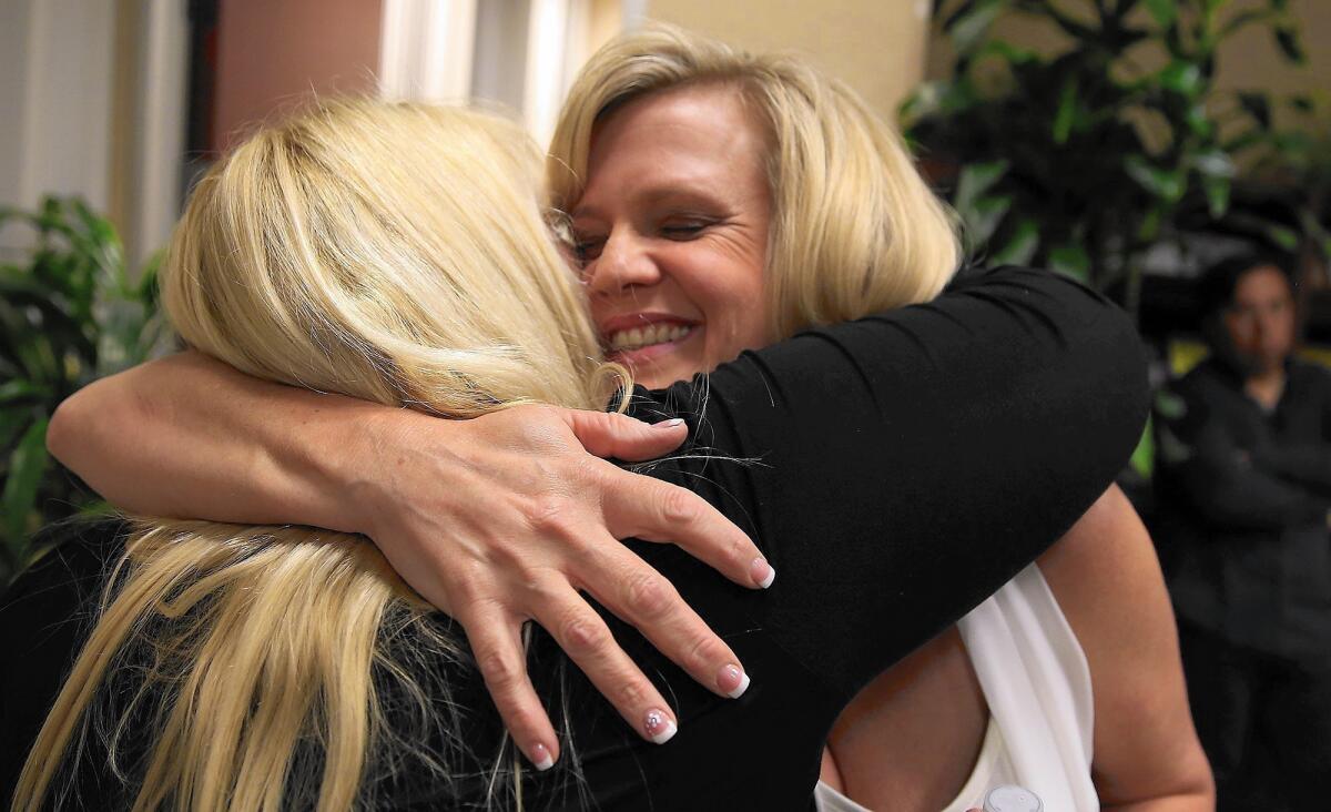 City of Industry council candidate Cory Moss, right, celebrates her win as she hugs Mary Radecki, wife of fellow winning candidate Mark Radecki.