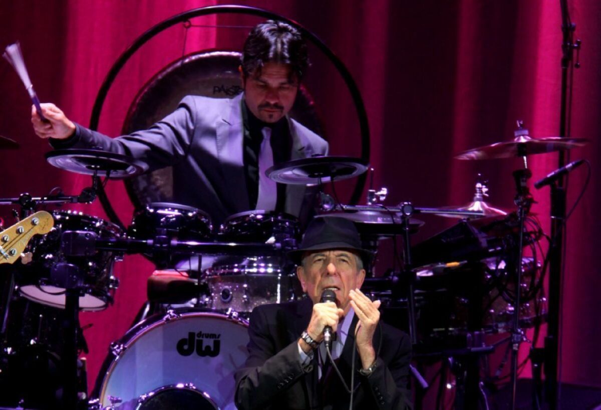 Leonard Cohen, whose band includes Rafael Gayol on percussion, played nearly 30 songs Monday night at Nokia Theatre in Los Angeles.