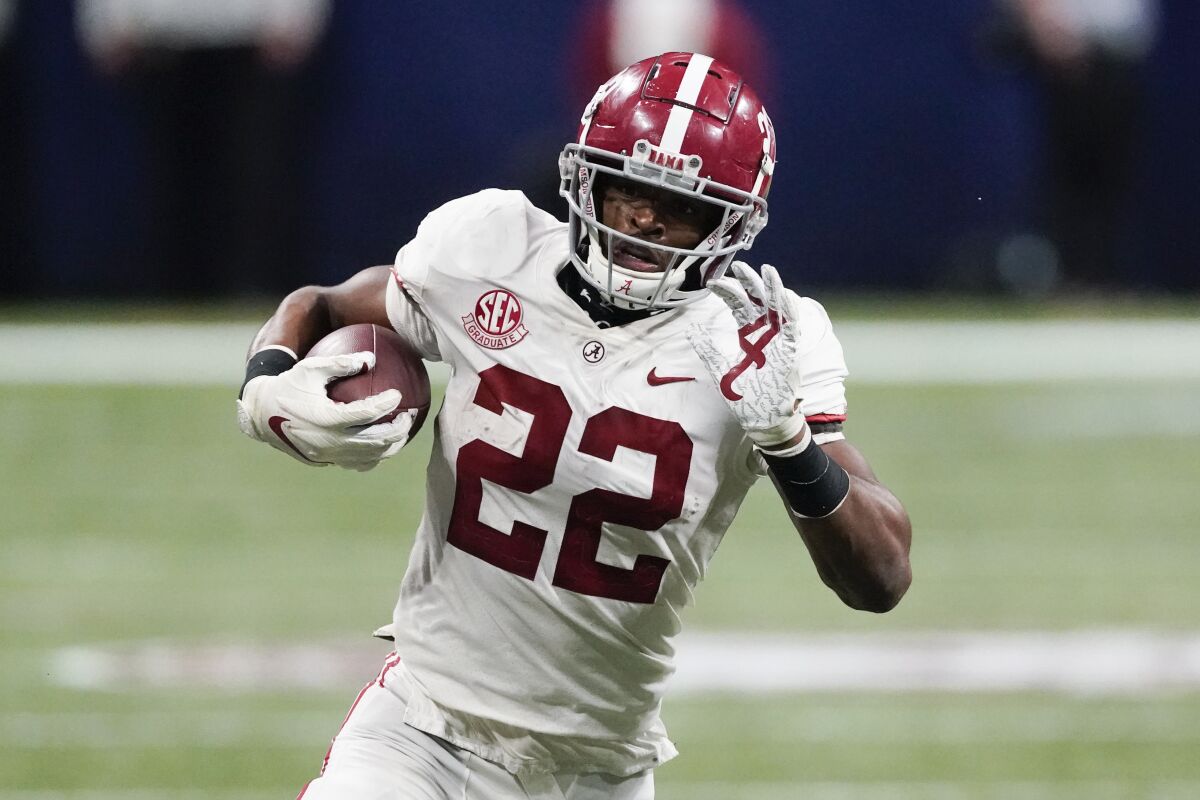Alabama running back Najee Harris carries the ball against Florida in the SEC title game Dec. 19, 2020, in Atlanta.