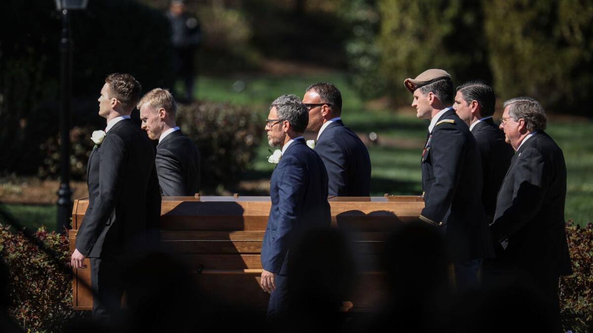 Pallbearers carry Billy Graham's casket during his funeral in Charlotte, N.C.