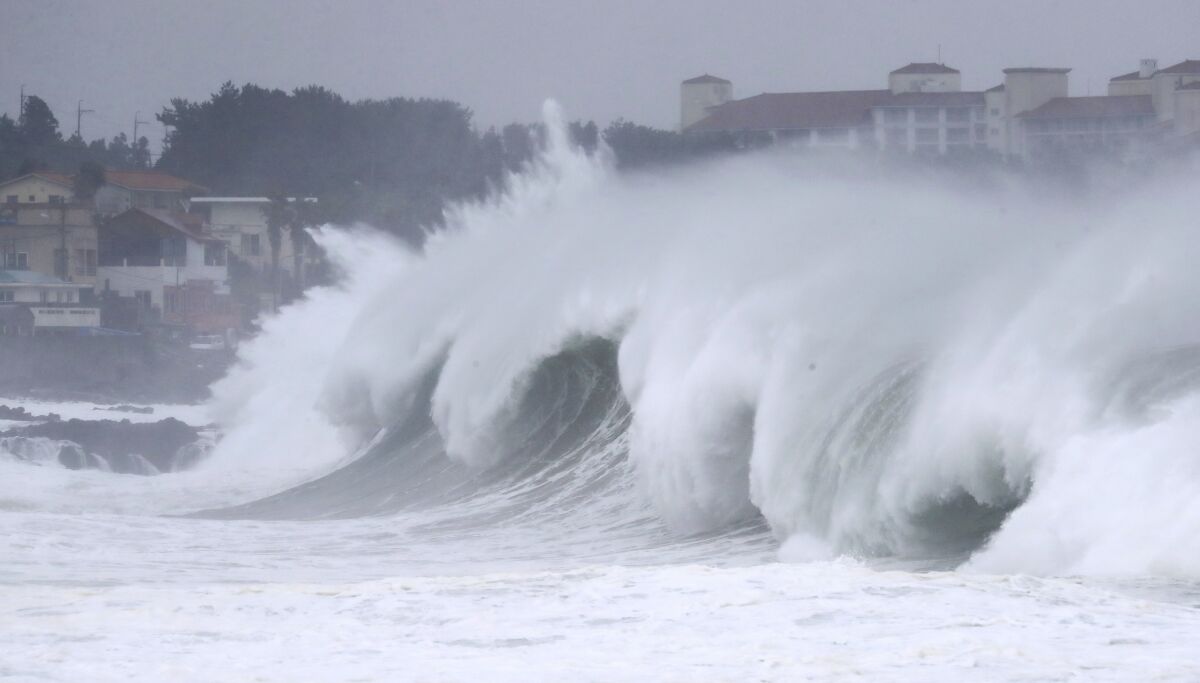 High waves crash a shore as Typhoon Maysak approach on Jeju Island, South Korea, Wednesday, Sept. 2, 2020. An offshore typhoon brought torrents of rain to southern Japan on Wednesday heading to the Korean Peninsula. (Park Ji-ho/Yonhap via AP)