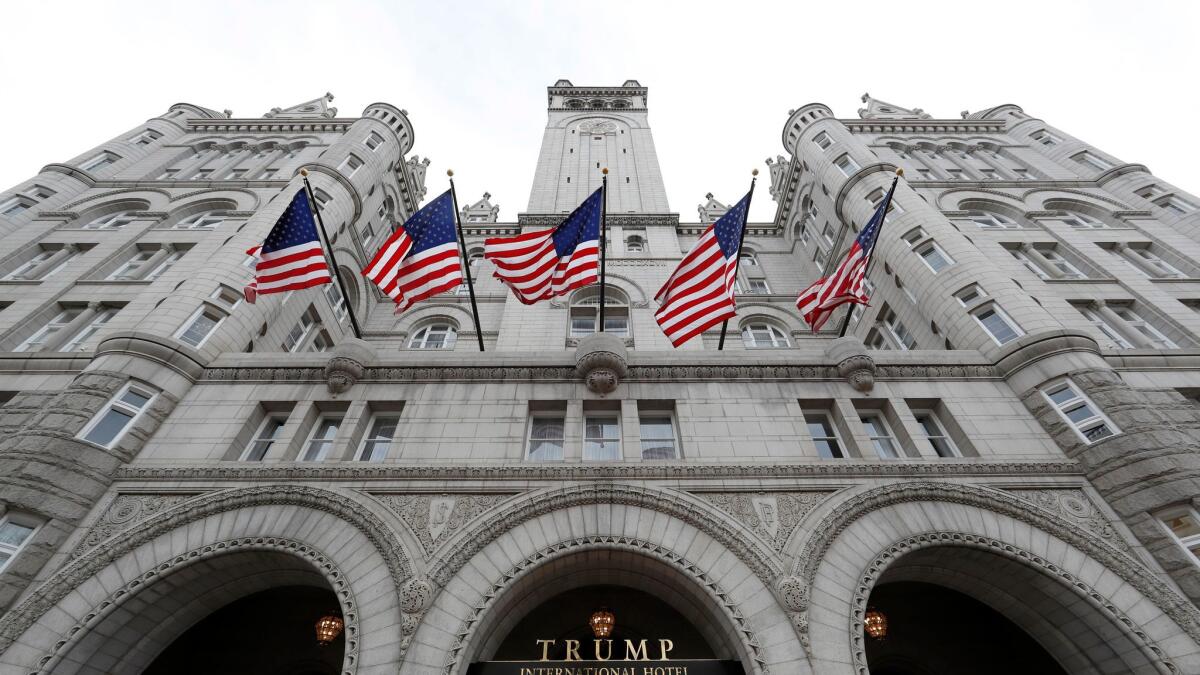 The Trump International Hotel is near Cork Wine Bar, whose owners say President Trump is unfairly using the power of his post to lure business.