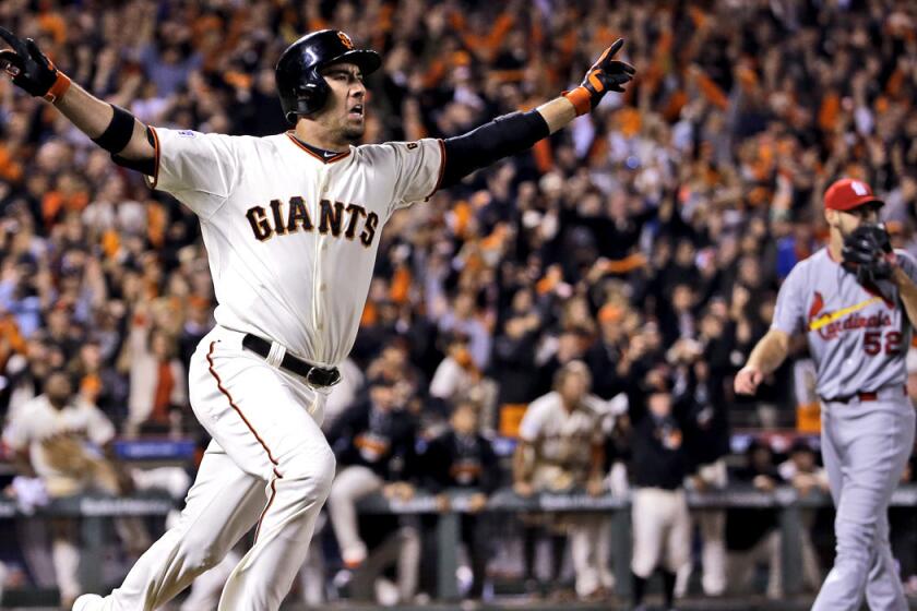 Giants left fielder Travis Ishikawa reacts after hitting a three-run home run against the Cardinals to win Game 5 of the NLCS in the bottom of the ninth inning Thursday night in San Francisco.