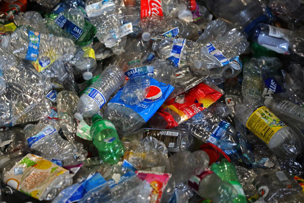 Recyclable plastic is compressed before being bundled at a plant in Wilmington in 2022. 