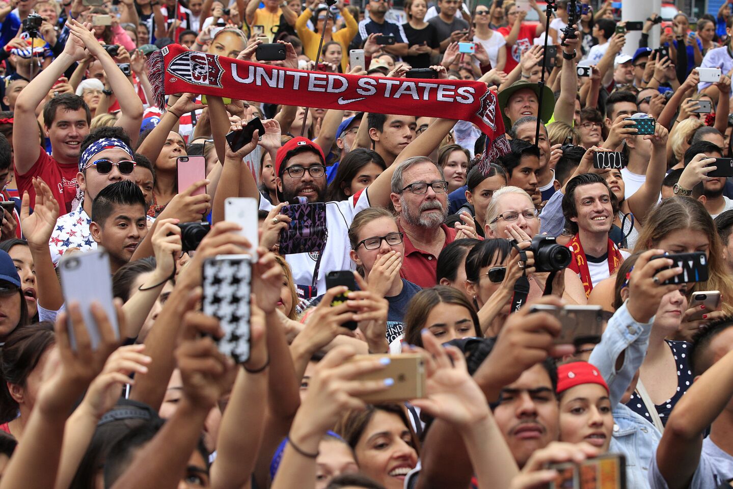 Thousands of fans cheer the U.S. team members.