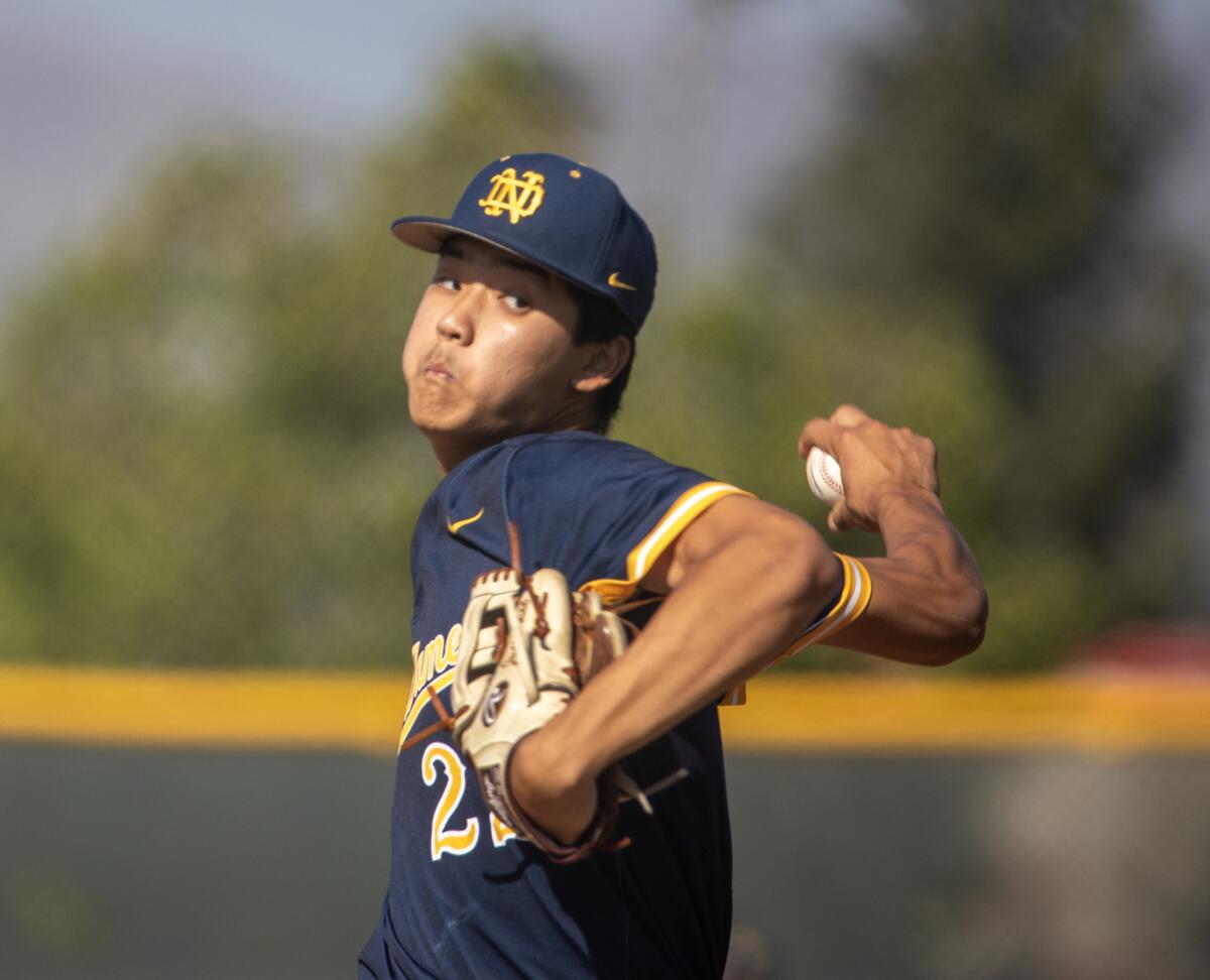 Notre Dame High's Justin Lee prepares to deliver a pitch during a game.