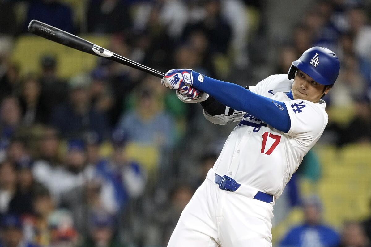 Dodgers star Shohei Ohtani hits a solo home run.